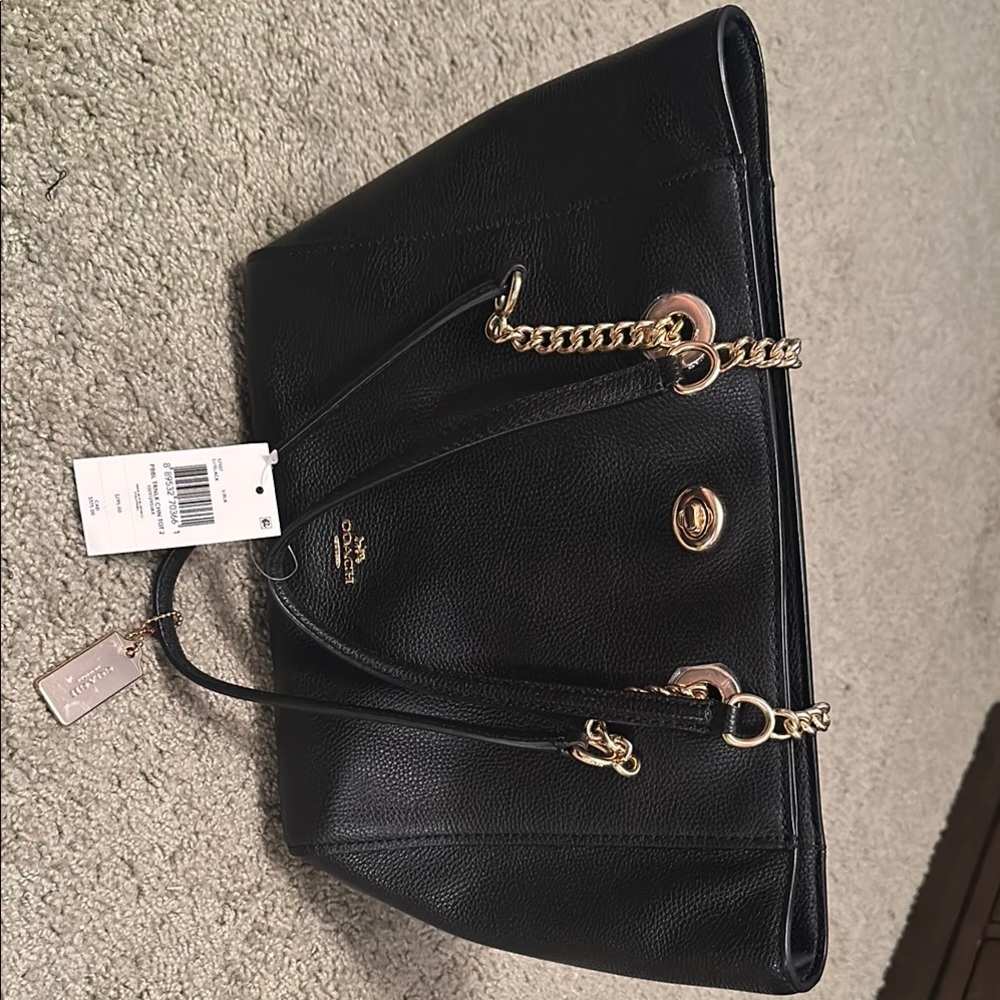 Coach Black Tote with Gold Accents and Structured Design
